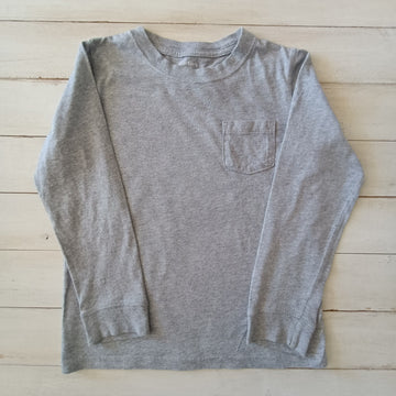 Polera Carter´s T7 Gris claro con bolsillo.