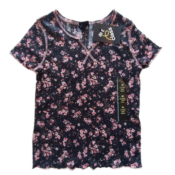 NUEVA Polera Art Class T7-8 Negra. Flores rosadas.