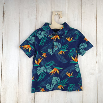 Polera Old Navy 12-18M Azul. Flores naranjas y amarillas. Hojas.