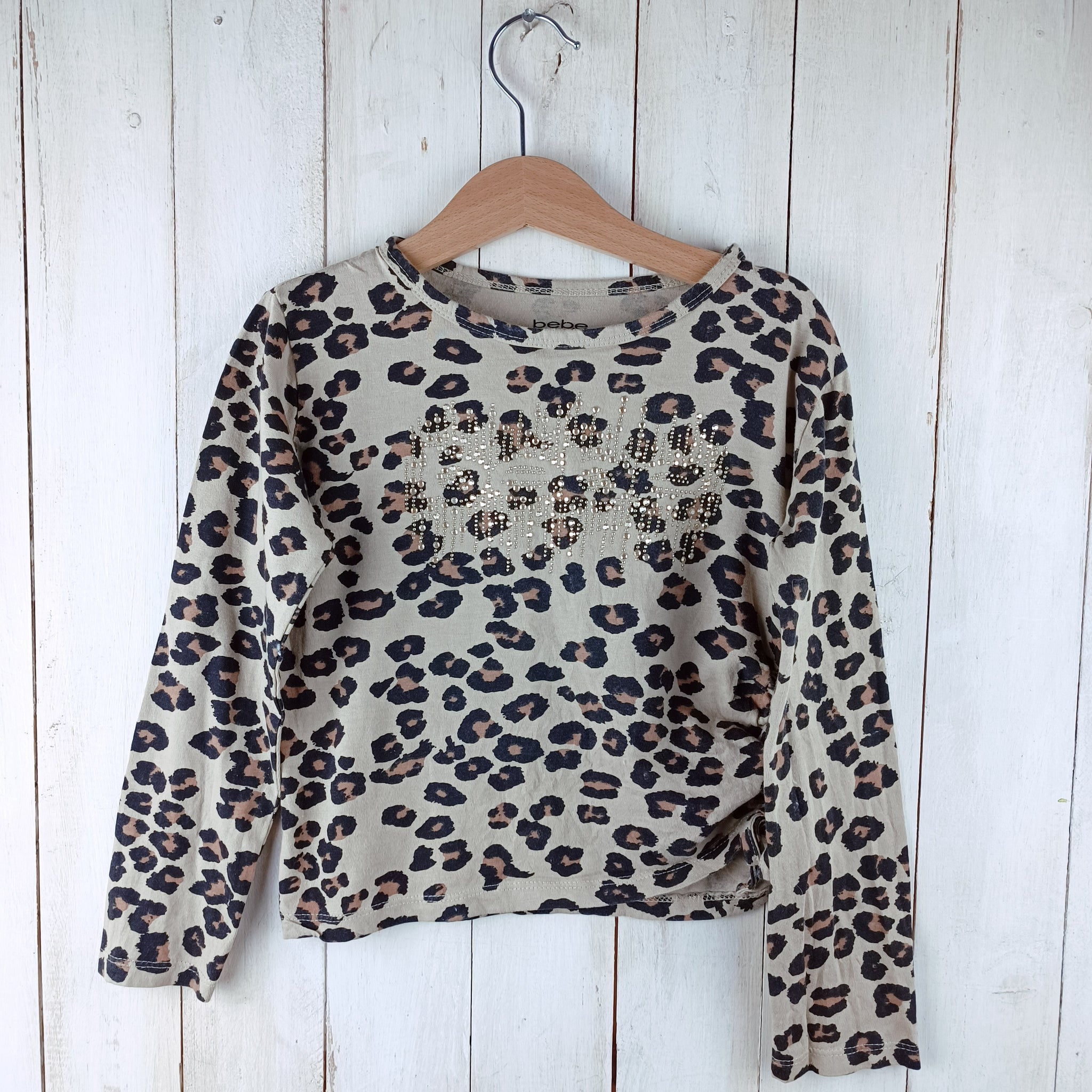 Polera bebe Talla 6 Animal Print Beige. Tachas Doradas