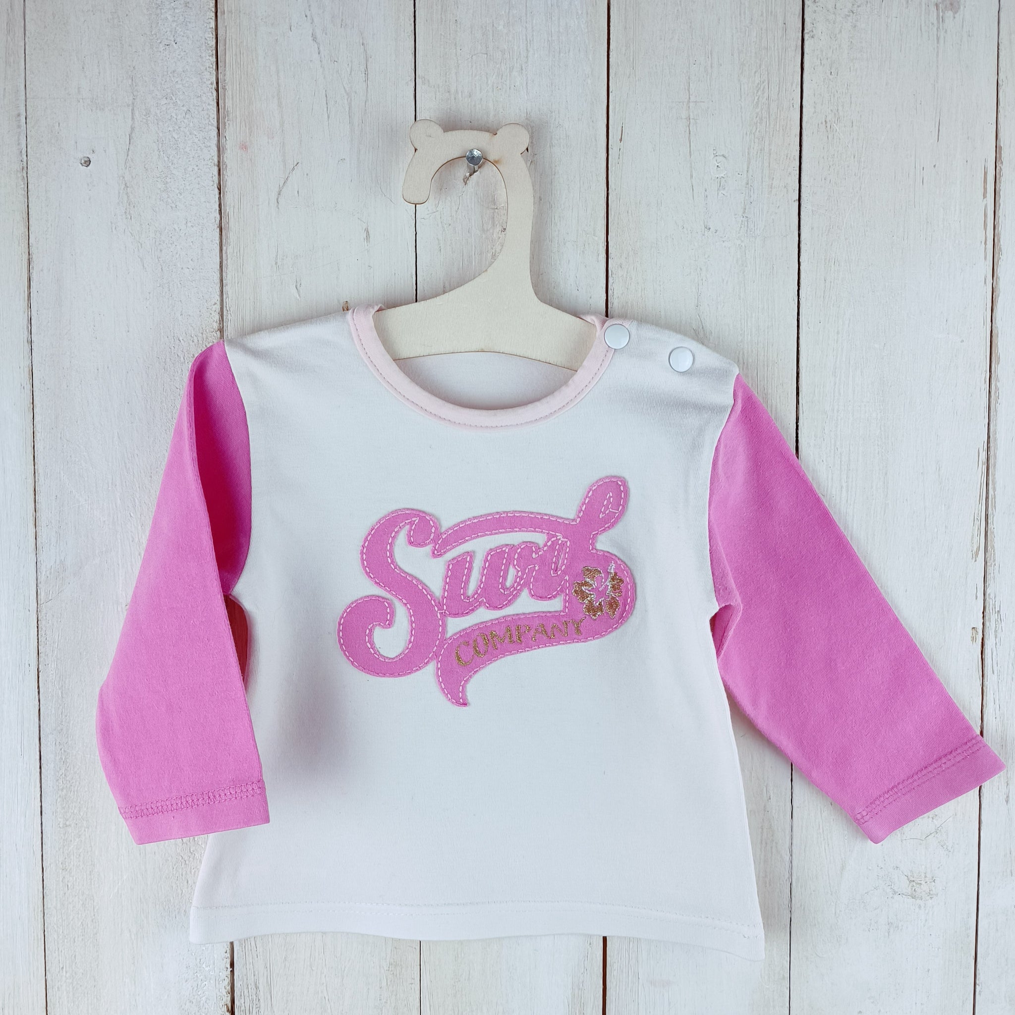 Polera Talla 6 meses Blanca. Mangas rosadas