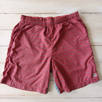 Short Wilson T7/8 Color Ladrillo con Gris