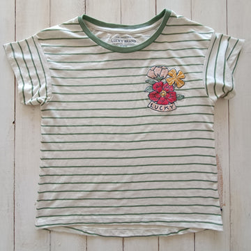 NUEVA. Polera Lucky Brand T10-12 Beige con líneas horizontales verdes. Flores bordadas.