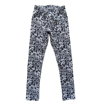 Pantalón Umbrale Kids Talla 10 Negro. Flores blancas.